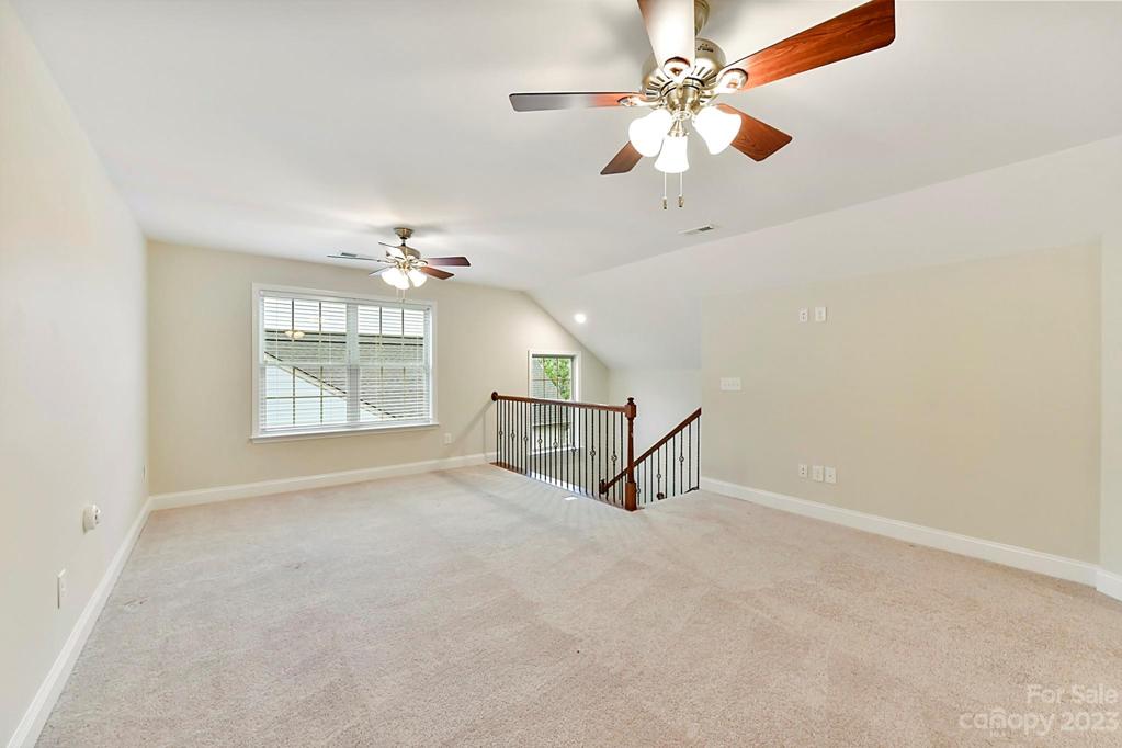 Upper Level Loft with Iron Baluster Stairs, Fan and Storage Access