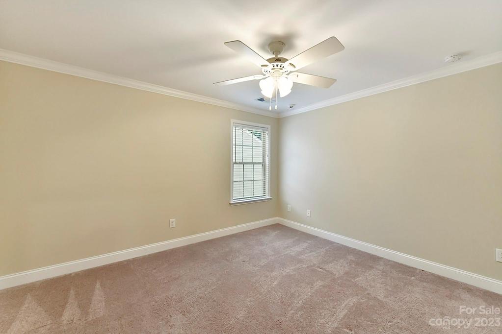 Upper Level Bedroom 3 with Moldings and Fan