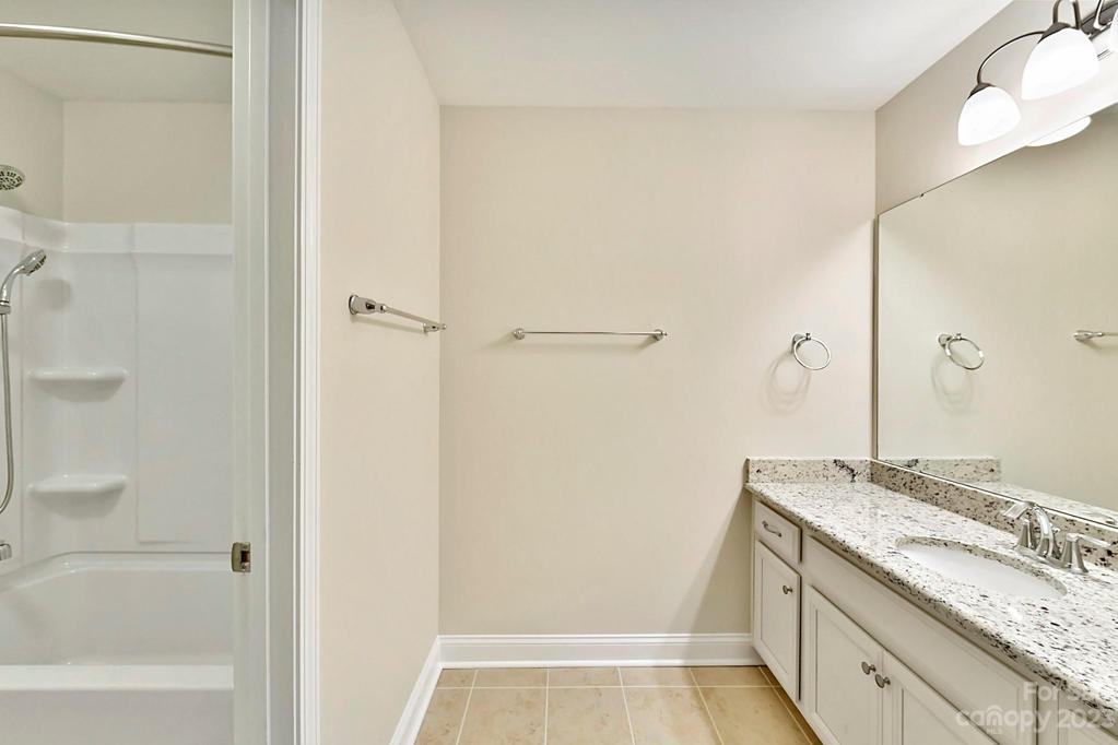 Upper Level Full Bath 3 with Granite Counters, Tiled Flooring and Separate Private Tub/Shower Location