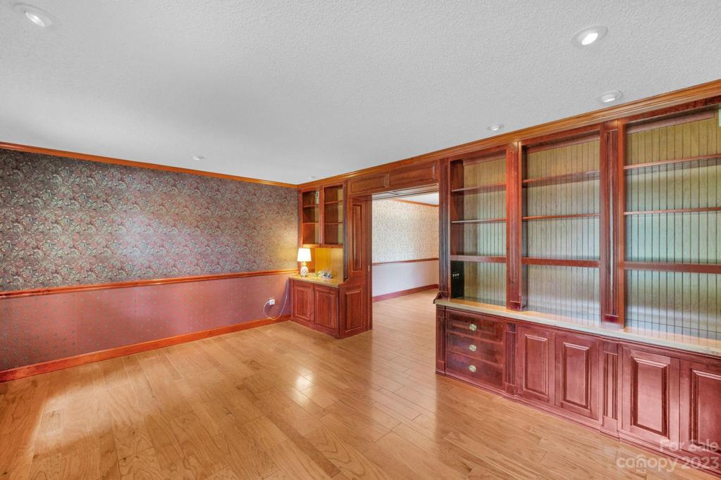 Linving room 15'11"x12'2", Custom bookshelves, pocket doors into dining room