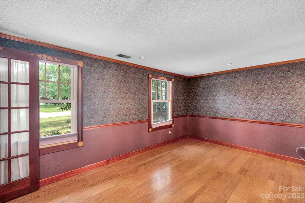 Living room entrance has French Doors from entrance foyer