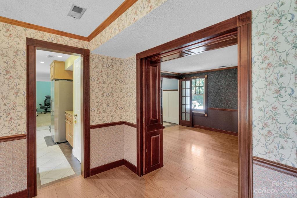 Looking at kitchen area and living room from dining room