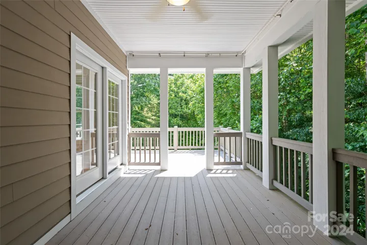 Covered deck off of the kitchen for dining outdoors that could be easily screened in