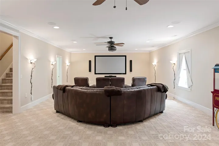Lower level Media/entertainment room with built-in theatre equipement and surround sound