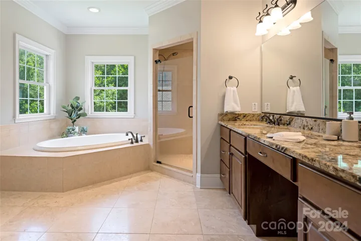 Primary bath with jetted tub and nice walk-in shower
