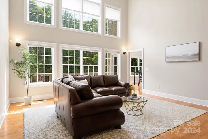 The great room's wall of windows allow tons of natural light into the homes main living areas