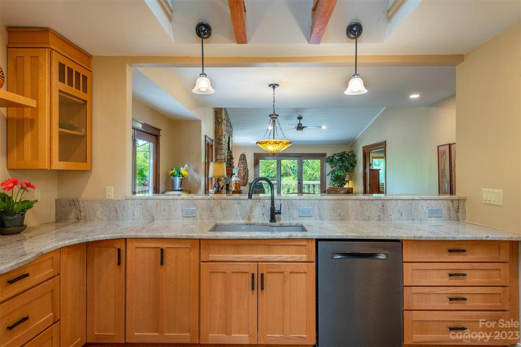 This wall was opened up to provide a great flow to the space! You can now see the attractive gas fireplace from the kitchen and be able to chat with people at the breakfast bar.