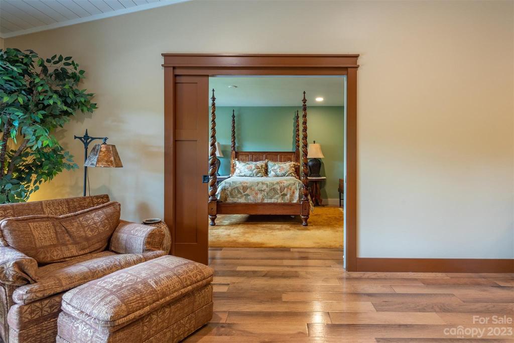 The entrance to the primary bedroom was moved so that the fireplace can be seen and enjoyed from the primary bedroom. This bedroom has pocket doors.