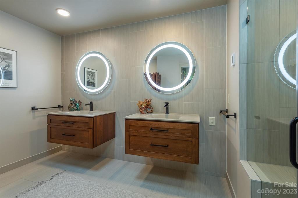 Wall hung vanities and modern vanity mirrors are shown here.