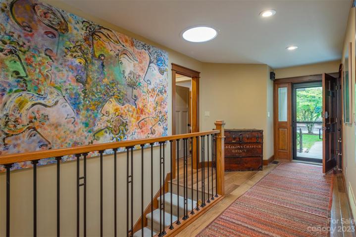 There has since been a railing mounted running down the wall here going down the stairs. The sun tube lets in lots of natural light, there are three within the home.
