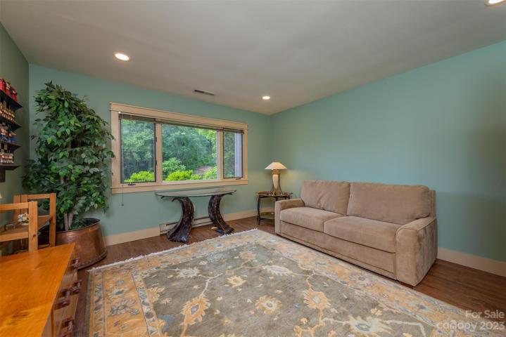 This is the third bedroom, located in the lower level, facing the pond.