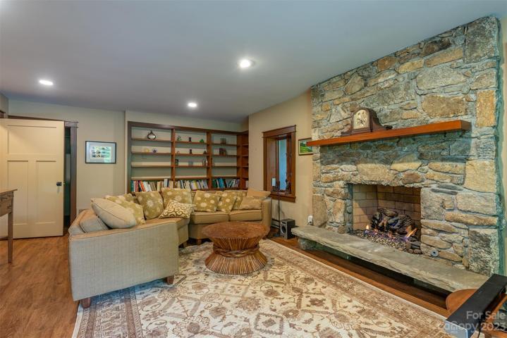 Plenty of built in shelves adorn the walls in this space.