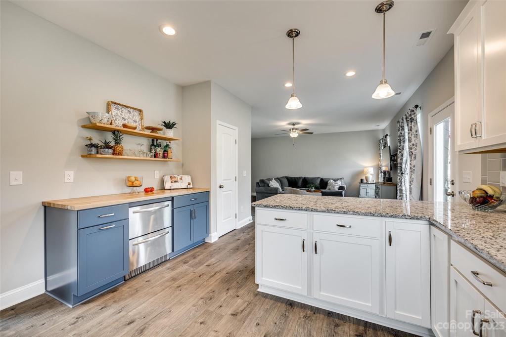 Owners added this custom bar with butcher block countertops and 2 refrigerated drawers