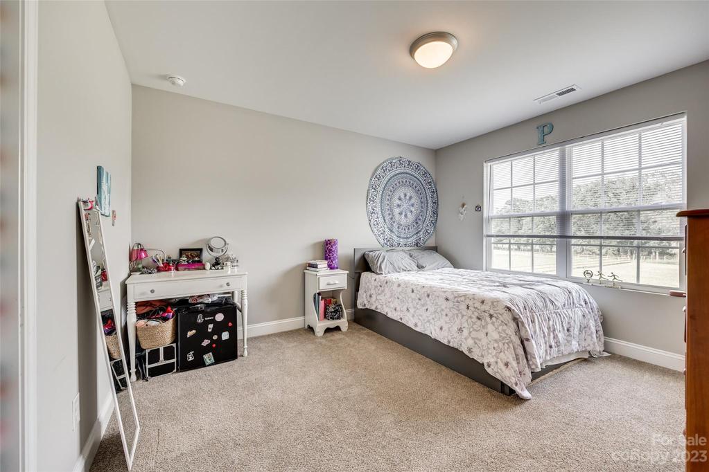 Secondary bedroom with walk-in closet