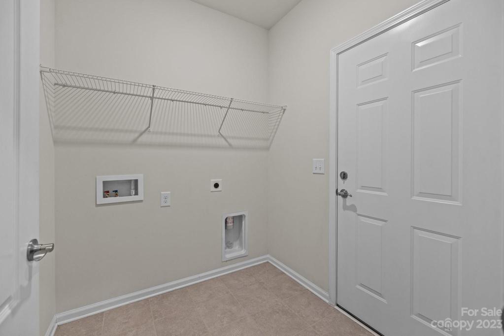 Separate laundry room off the garage