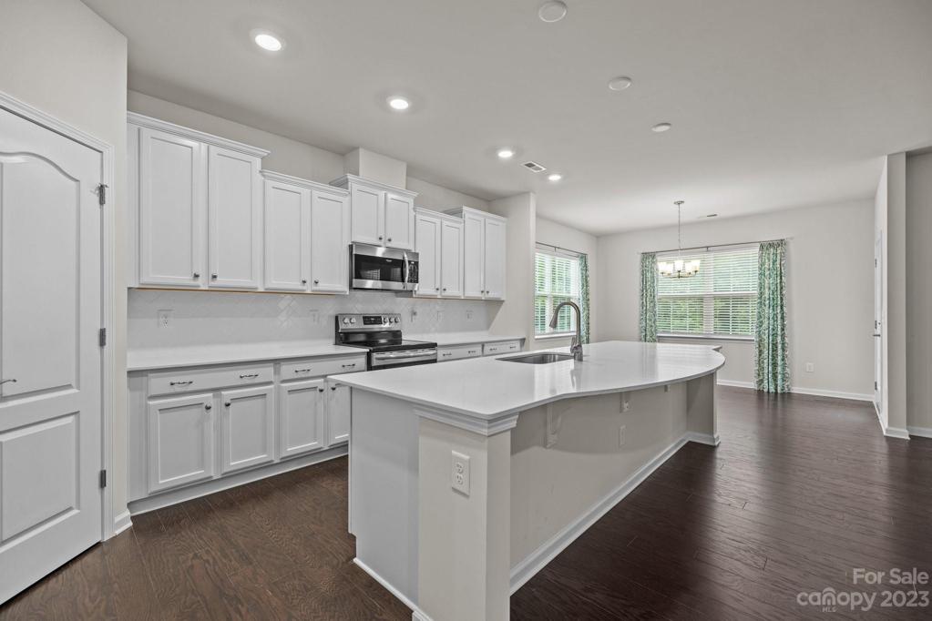 Large roomy kitchen with quartz countertops