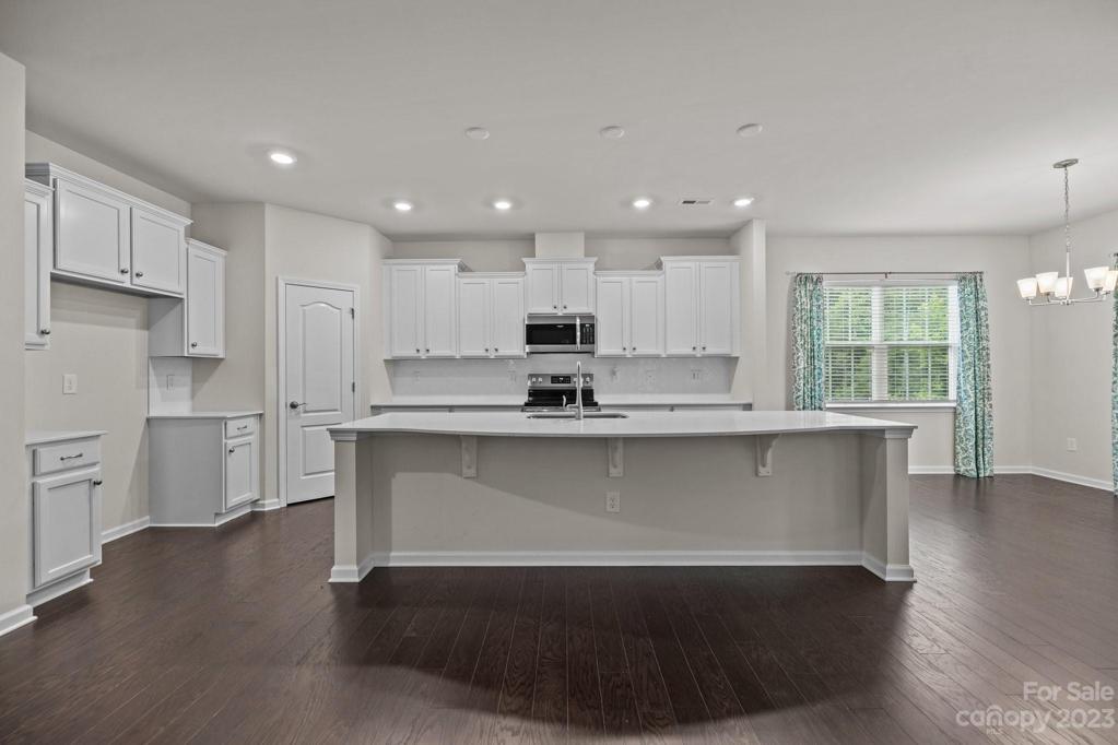Plenty of room for guests to gather around this kitchen island
