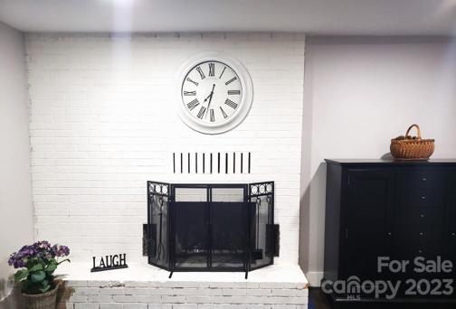 Living Room with brick fireplace