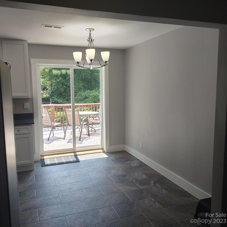 Dining area with sliding door access to deck