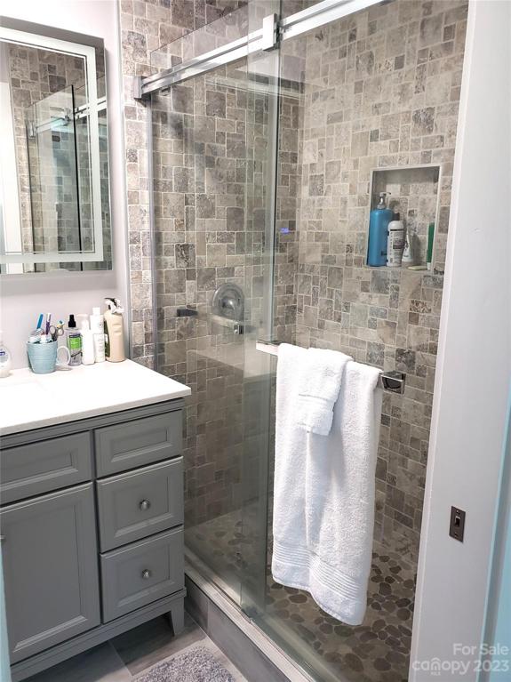 Primary Bathroom Tiled shower with glass doors