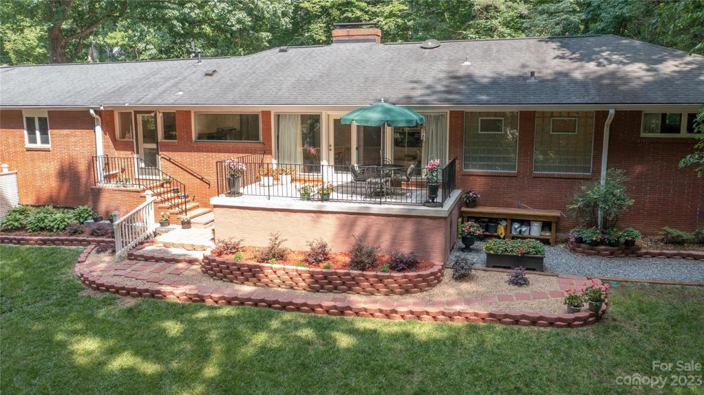 Back of home with patio