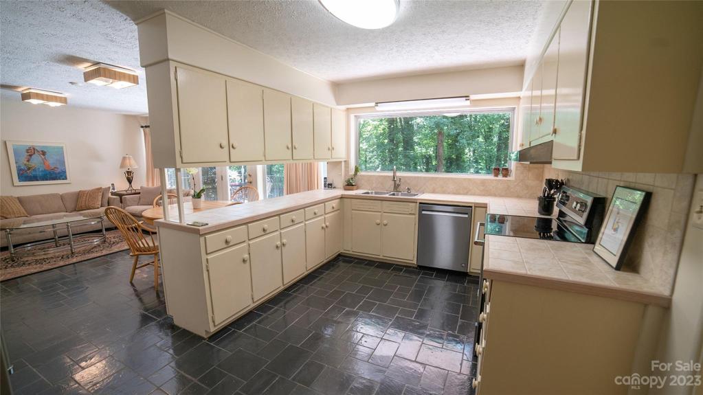 Kitchen opens to Den