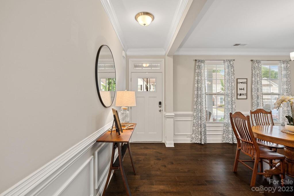 Inviting foyer that opens to the formal dining room.