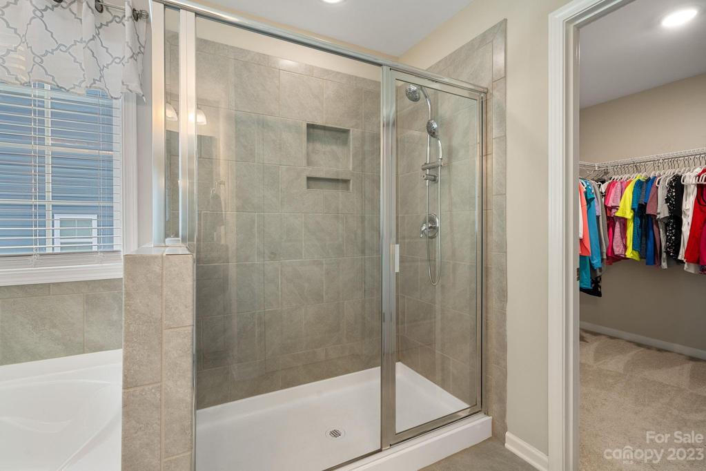 Oversized TILE shower in primary bath.