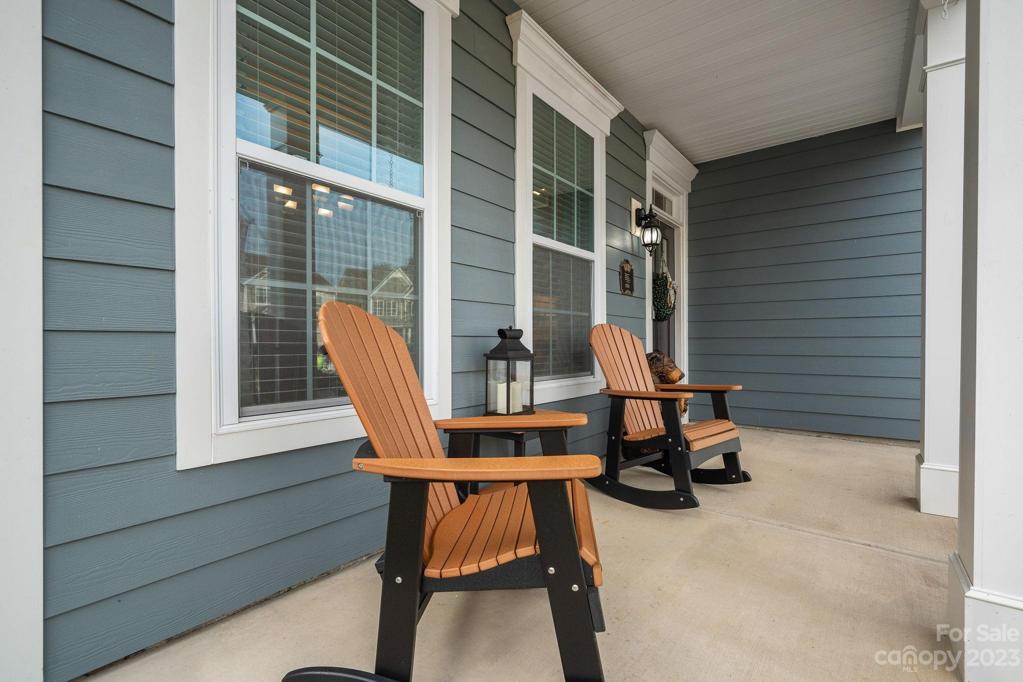 Lovely rocking chair front porch overlooking the quiet and peaceful cul-de-sac.