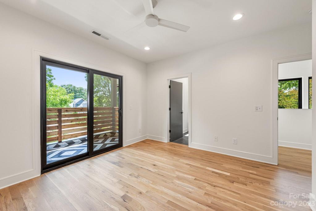 Upper bedroom with balcony.