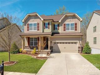 Rocking Chair Covered Front Porch with Stone Accents