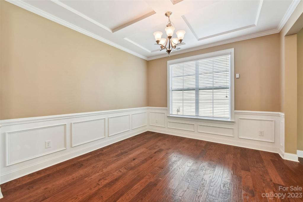 Dining room Accented by Crown and Chair Molding. Cofferred Ceiling