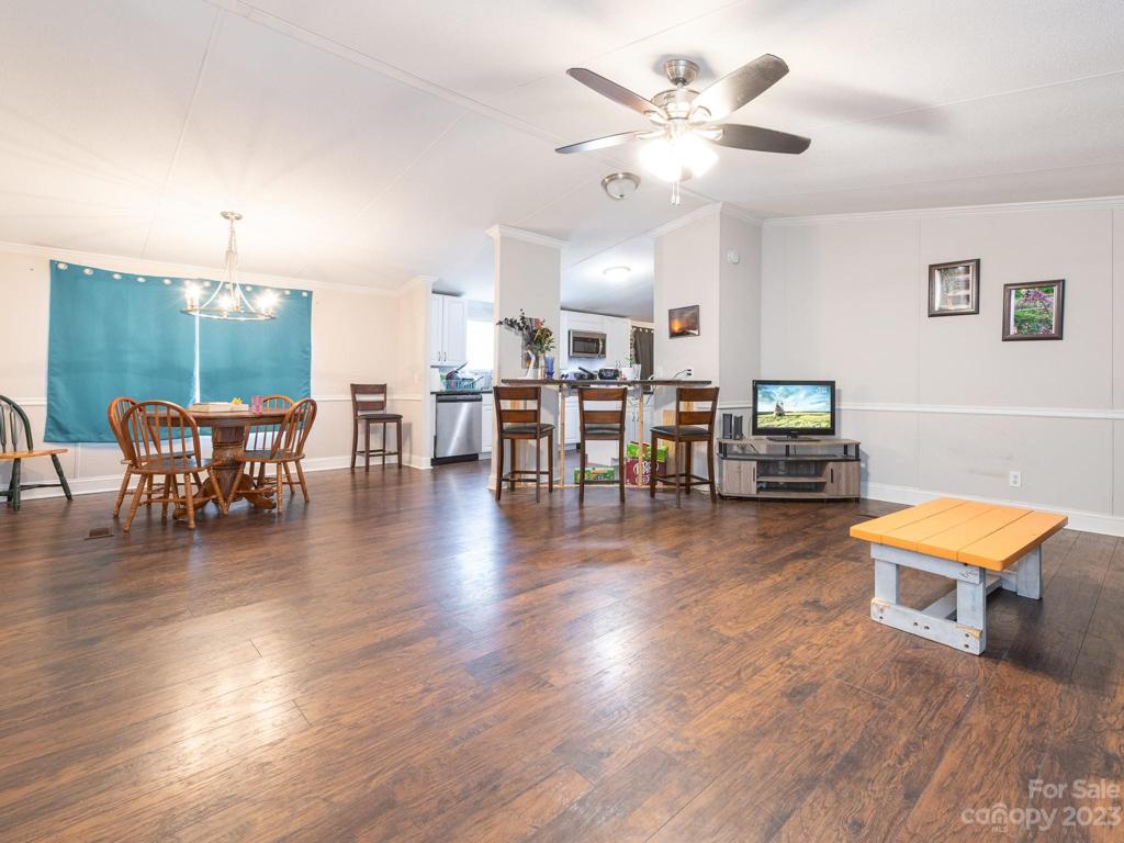 Open Living plan with Dining Area and bar seating in kitchen