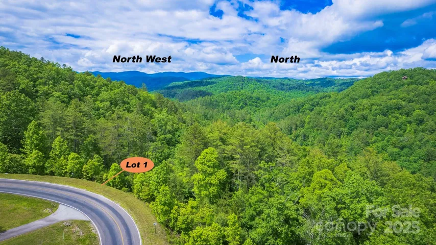This aerial photo shows the orientation of the directions to this lot location. And, it also shows the wonderful mountain ranges surrounding this property.