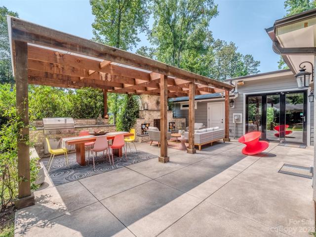 Accordian Doors Open to Amazing Outdoor Living Space with Fireplace, & Outdoor Kitchen with Natural Gas Line Run to the Grill!