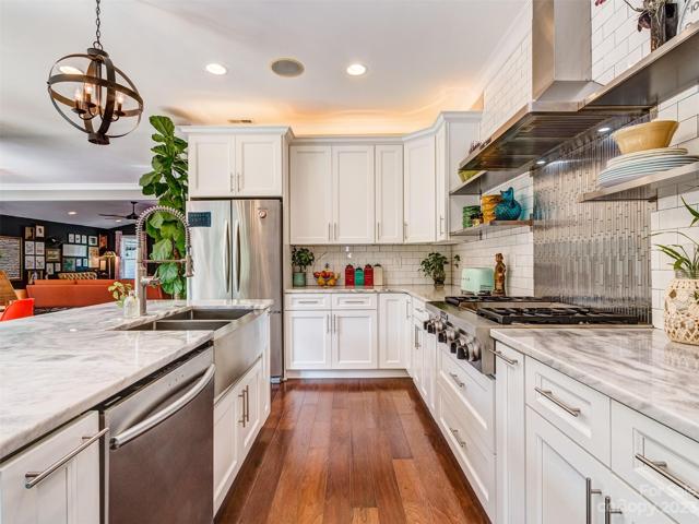 Gourmet Kitchen with Stainless Appliances, Marble Countertops, Island, Gas Cooktop, Wall Oven, Subway Tile Backsplash, Recessed Lights, Built-In Speakers and More!