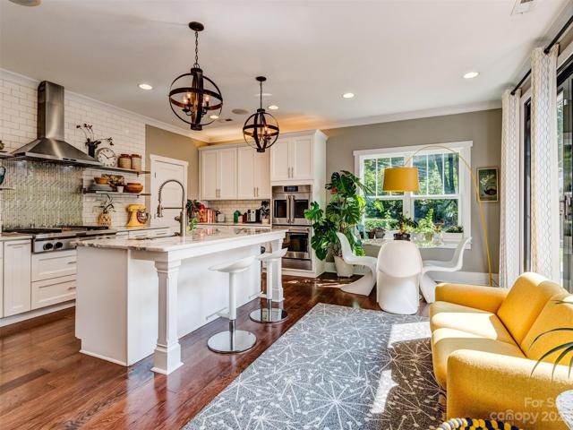 Gourmet Kitchen with Stainless Appliances, Marble Countertops, Island, Gas Cooktop, Wall Oven, Subway Tile Backsplash, Recessed Lights, Built-In Speakers and More!