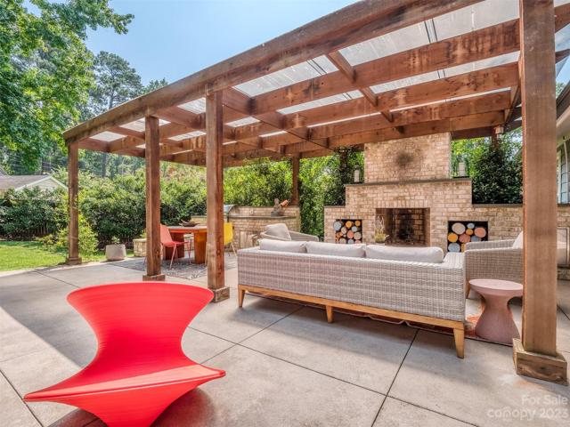 Accordian Doors Open to Amazing Outdoor Living Space with Fireplace, & Outdoor Kitchen with Natural Gas Line Run to the Grill!