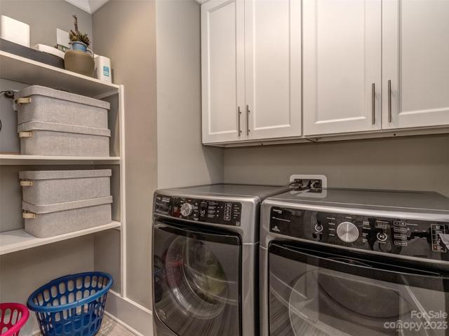 Large Laundry Room with Cabinets & Custom Shelving