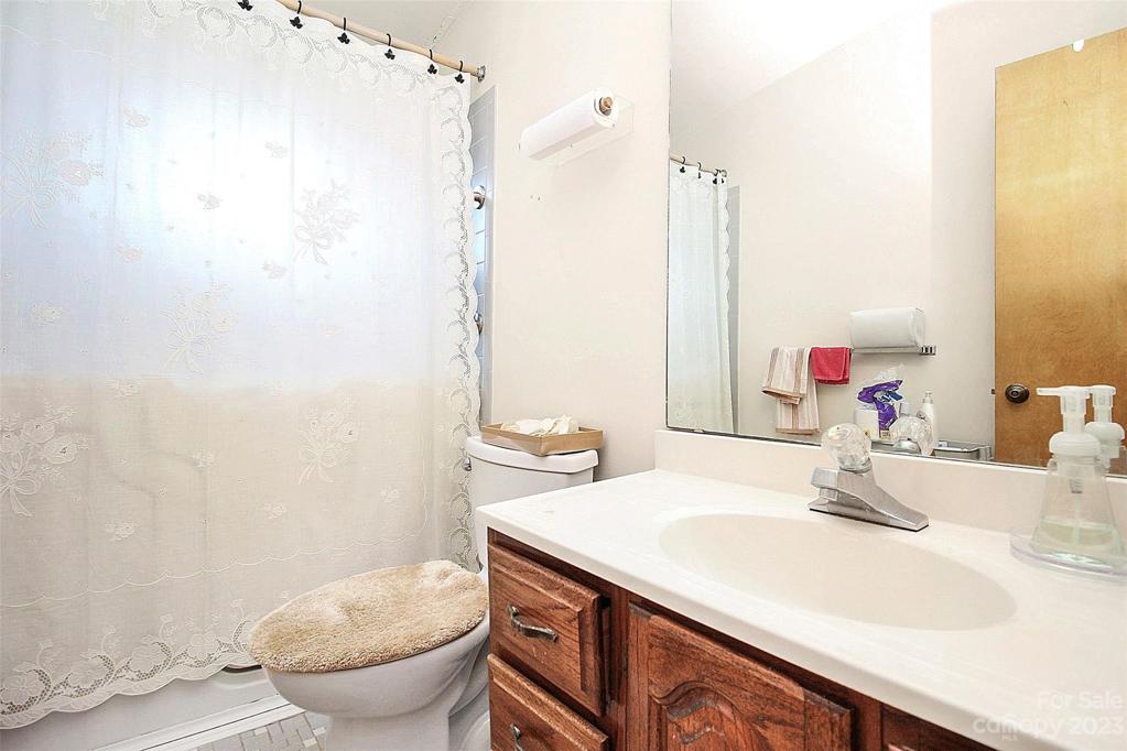 Hall bath located near the den