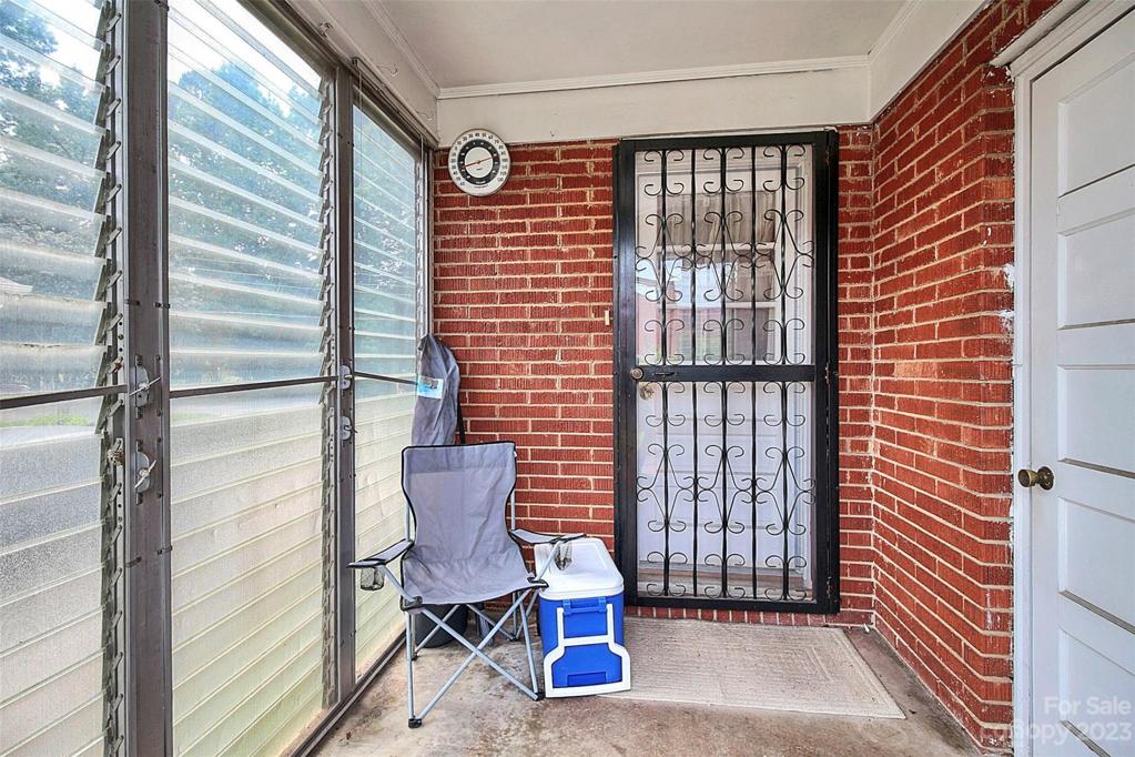 Enclosed porch. Backdoor out of the Kitchen