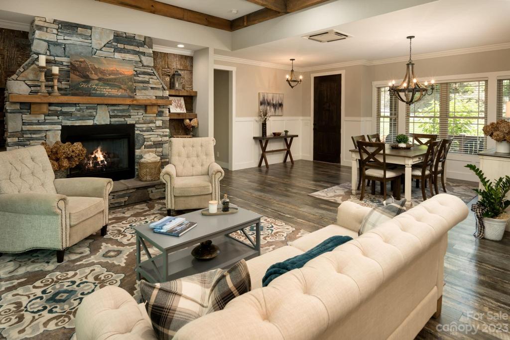 Remarkable rough sawn post and beams, dramatic stacked stone fireplace, lovely poplar birch built-ins