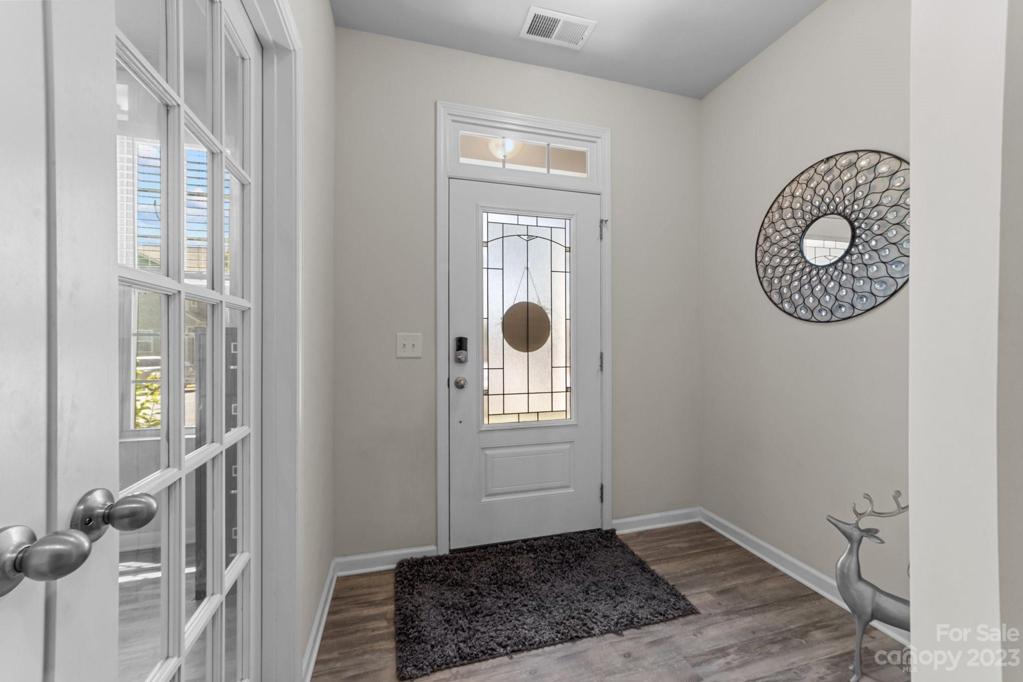 Quiet entryway on main level with room for drop off.  French doors lead to office/flex space.