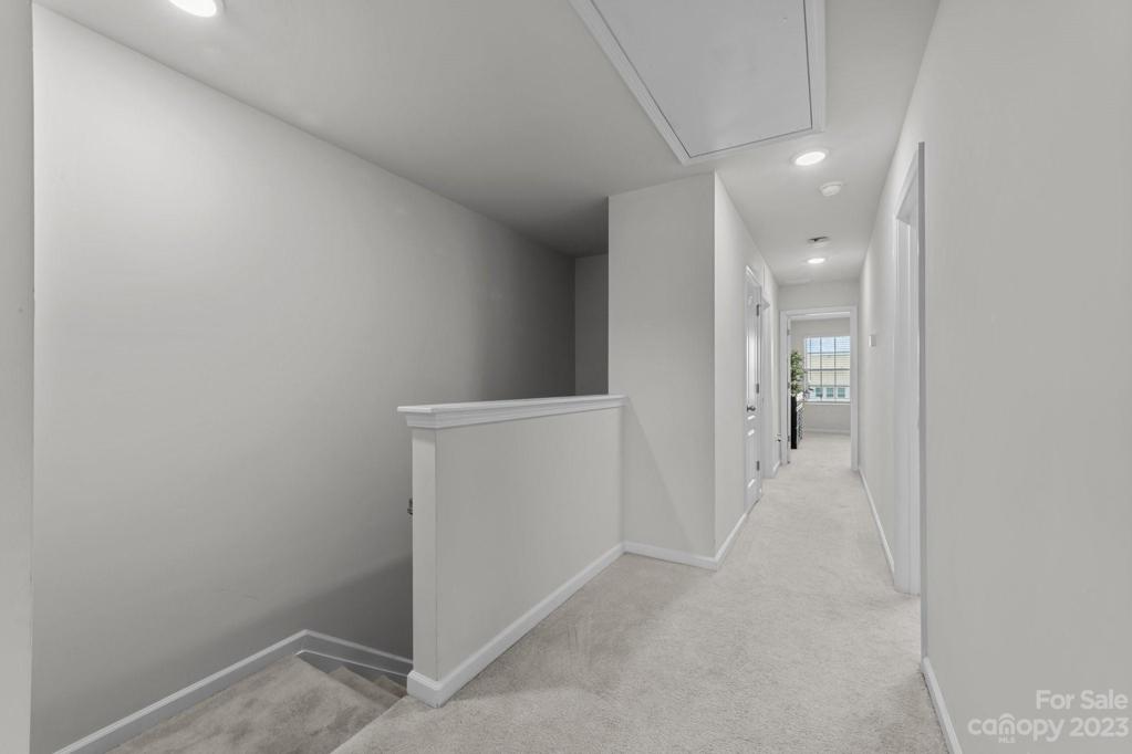 Upstairs hallway from front bedrooms, down hall to hall bath, laundry and Primary suite.