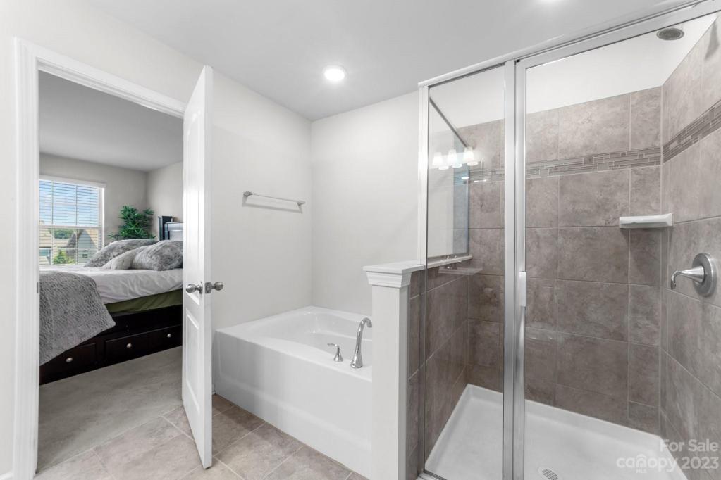 Primary Bedroom Suite Bath -- take your choice of shower or soak your cares away!