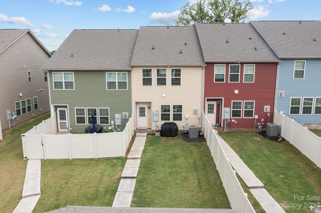 Backyard is partially fenced, grassed and ready for your vision!