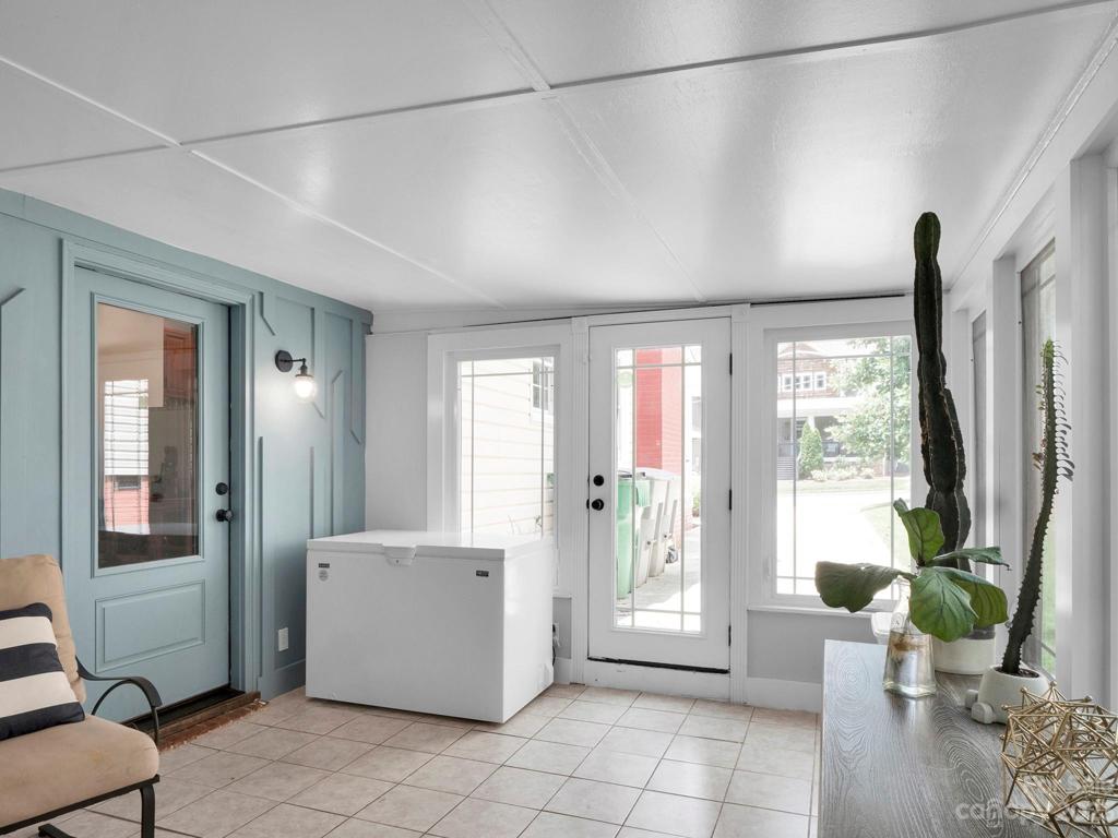 Sunroom has tile floor