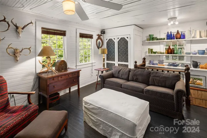 Cozy living room with bead board walls and ceilings.