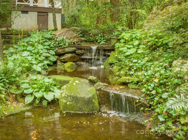 Mountain oasis with lush gardens, treasured trees, and flowing water