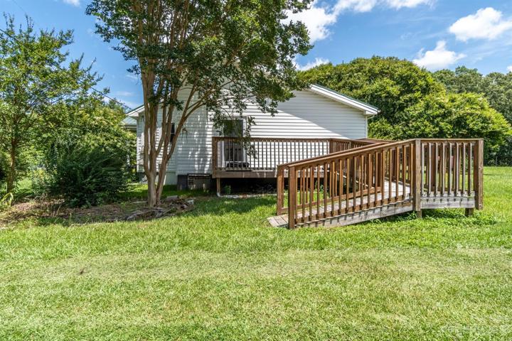 Side view of home with deck off of the laundry room